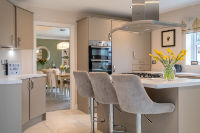 A photo of an aspirational kitchen with island