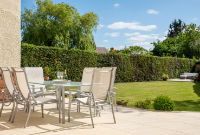 A photo of an impressive garden with dining area